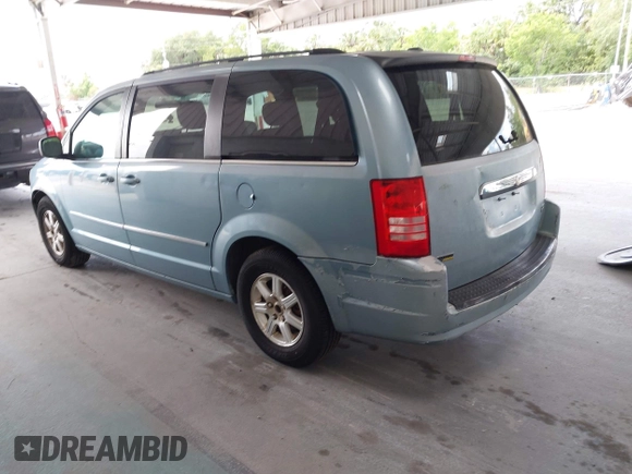 2009 Chrysler Town & Country Touring with VIN 2A8HR54119R584798, listed as a IAAI auction lot 42183484 with 174,871 mi miles and . Bid and sale history available at DreamBid. Image 3.