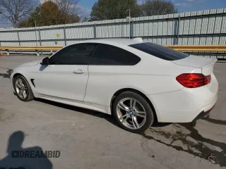 2015 BMW 4 Series 428i xDrive with VIN WBA3N5C5XFK197692, listed as a Copart auction lot 77219684 with 96,148 mi miles and Salvage title. Bid and sale history available at DreamBid. Image 2.