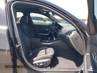 2019 BMW 3 Series 330i with VIN WBA5R1C51KFH09402, listed as a IAAI auction lot 41869138 with 59,115 mi miles and . Bid and sale history available at DreamBid. Image 5.