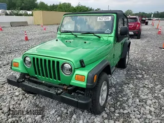 2004 Jeep Wrangler SE with VIN 1J4FA29124P769475, listed as a Copart auction lot 64371244 with 136,877 mi miles and Salvage title. Bid and sale history available at DreamBid. Image 12.