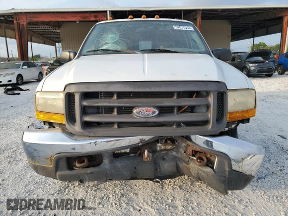 2000 Ford Super Duty F-250 XL with VIN 1FTNF21F7YEA97991, listed as a Copart auction lot 54577544 with 82,036 mi miles and Salvage Title. Bid and sale history available at carsss.com. Image 5.