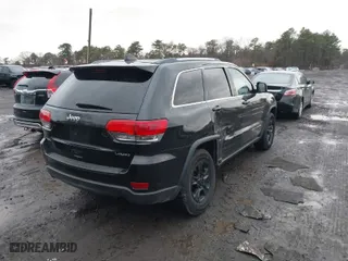 2014 Jeep Grand Cherokee Laredo with VIN 1C4RJFAG7EC119978, listed as a IAAI auction lot 41161797 with 140,823 mi miles. Bid and sale history available at carsss.com. Image 4.