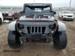 2014 Jeep Wrangler Unlimited Sport with VIN 1C4BJWDG4EL115321, listed as a Copart auction lot 51297255 with 176,685 mi miles and Salvage Title. Bid and sale history available at carsss.com. Image 5.