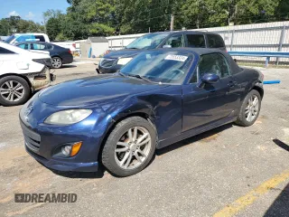 2011 Mazda MX-5 Miata Sport z VIN JM1NC2JF6B0216451, wystawiony jako Copart lot #73553324 z przebiegiem 136 309 mil mil oraz Szkoda całkowita • Salvage title. Historia ofert i sprzedaży dostępna na DreamBid. Obrazek 1.