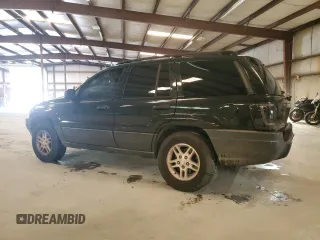 2003 Jeep Grand Cherokee Laredo with VIN 1J4GX48S13C601387, listed as a Copart auction lot 60544295 with 217,485 mi miles and Salvage title. Bid and sale history available at DreamBid. Image 2.