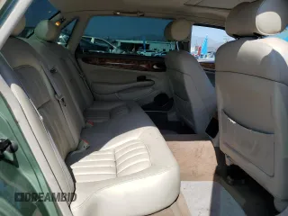 1999 Jaguar XJ with VIN SAJHX604XXC854217, listed as a Copart auction lot 56042735 with 127,092 mi miles and Salvage title. Bid and sale history available at DreamBid. Image 10.