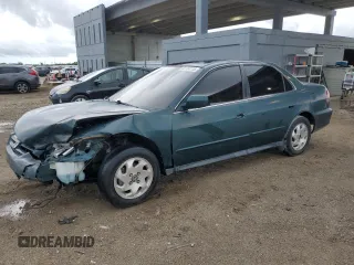 2002 Honda Accord LX with VIN 1HGCG564X2A067736, listed as a Copart auction lot 60104115 with 204,882 mi miles and Salvage title. Bid and sale history available at DreamBid. Image 1.