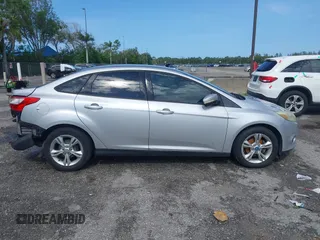 2013 Ford Focus SE with VIN 1FADP3F28DL217636, listed as a IAAI auction lot 42465123 with 187,088 mi miles and . Bid and sale history available at DreamBid. Image 14.