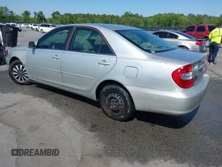 2004 Toyota Camry LE with VIN 4T1BE32K04U319290, listed as a IAAI auction lot 42019125 with 304,666 mi miles. Bid and sale history available at carsss.com. Image 3.