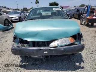 1999 Ford Escort LX with VIN 1FAFP10P6XW196483, listed as a Copart auction lot 59215635 with 74,859 mi miles and Salvage title. Bid and sale history available at DreamBid. Image 5.