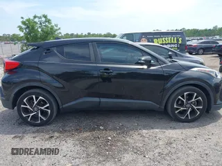 2018 Toyota C-HR XLE with VIN NMTKHMBX0JR008423, listed as a IAAI auction lot 42091445 with 124,811 mi miles. Bid and sale history available at carsss.com. Image 13.