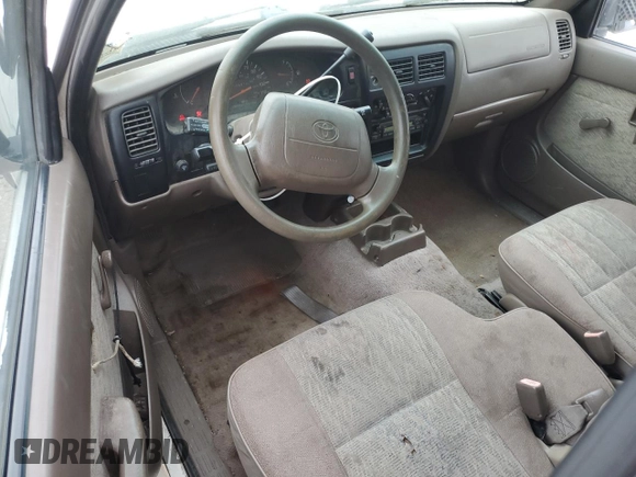 1999 Toyota Tacoma z VIN 4TAVL52N6XZ555376, wystawiony jako Copart lot #85763154 z przebiegiem 229 914 mil mil oraz Nie do naprawy • Non repairable. Historia ofert i sprzedaży dostępna na DreamBid. Obrazek 8.