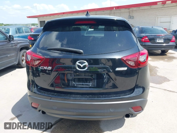 2016 Mazda CX-5 Grand Touring z VIN JM3KE2DY2G0765444, wystawiony jako IAAI lot #42527577 z przebiegiem 162 871 mil mil oraz . Historia ofert i sprzedaży dostępna na DreamBid. Obrazek 16.