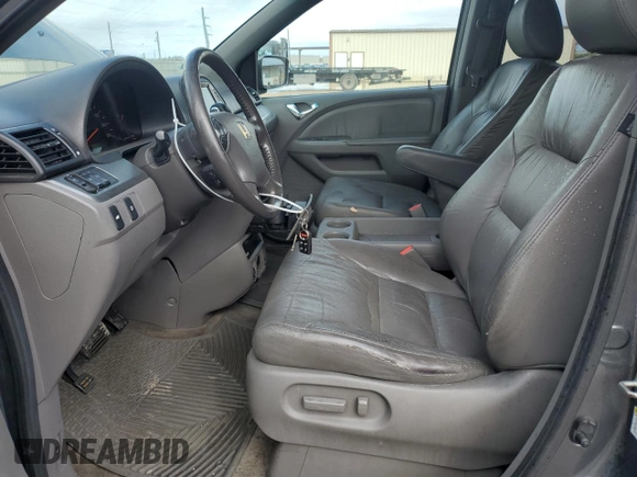 2010 Honda Odyssey EX-L with VIN 5FNRL3H72AB055070, listed as a Copart auction lot 80328974 with 221,467 mi miles and Salvage Title. Bid and sale history available at DreamBid. Image 7.