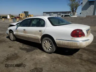 2001 Lincoln Continental z VIN 1LNHM97V31Y673523, wystawiony jako Copart lot #52451385 z przebiegiem 133 879 mil mil oraz Szkoda całkowita • Salvage title. Historia ofert i sprzedaży dostępna na DreamBid. Obrazek 2.