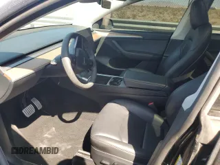 2023 Tesla Model Y Performance with VIN 7SAYGDEF8PF925238, listed as a Copart auction lot 46276925 with 28,201 mi miles and Salvage Title. Bid and sale history available at DreamBid. Image 7.
