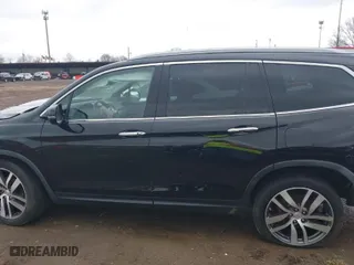 2017 Honda Pilot Touring with VIN 5FNYF6H95HB007854, listed as a IAAI auction lot 41955509 with 103,202 mi miles. Bid and sale history available at carsss.com. Image 14.