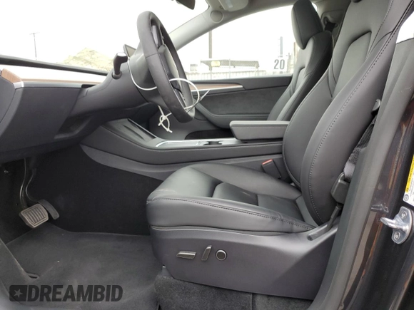 2025 Tesla Model Y Long Range with VIN 7SAYGDED4SF242721, listed as a Copart auction lot 56159955 with 7,131 mi miles and Salvage Title. Bid and sale history available at DreamBid. Image 7.