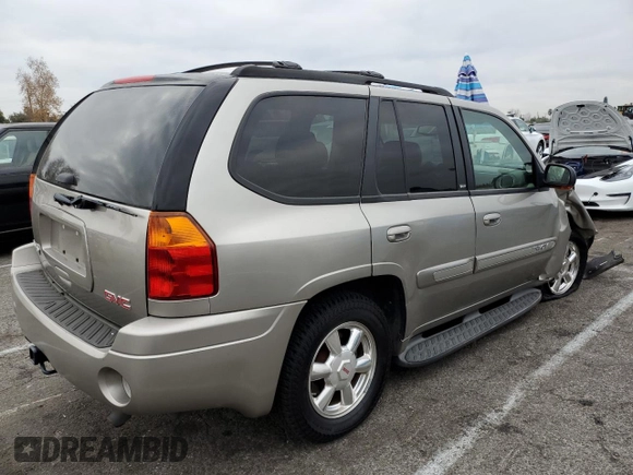2003 GMC Envoy SLE with VIN 1GKDS13S232236886, listed as a Copart auction lot 43220545 with 58,229 mi miles and Salvage Title. Bid and sale history available at carsss.com. Image 3.