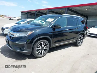 2019 Honda Pilot Touring 7-Passenger with VIN 5FNYF6H67KB031988, listed as a IAAI auction lot 42519588 with 41,368 mi miles and . Bid and sale history available at DreamBid. Image 2.