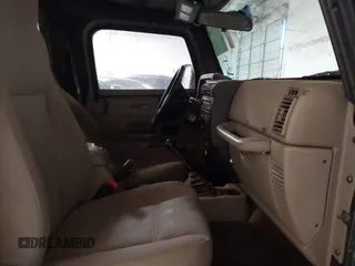 2003 Jeep Wrangler X z VIN 1J4FA39S43P339234, wystawiony jako IAAI lot #41329654 z przebiegiem 175 376 mil mil oraz . Historia ofert i sprzedaży dostępna na DreamBid. Obrazek 5.