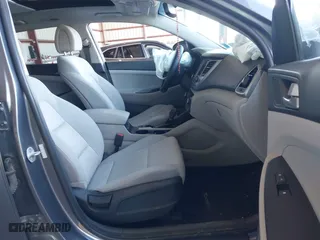 2018 Hyundai Tucson Value with VIN KM8J3CA20JU762120, listed as a IAAI auction lot 41878796 with 103,346 mi miles. Bid and sale history available at carsss.com. Image 5.