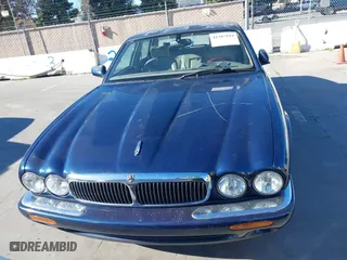 2000 Jaguar XJ with VIN SAJDA14C4YLF16529, listed as a IAAI auction lot 41387819 with 90,143 mi miles. Bid and sale history available at carsss.com. Image 6.