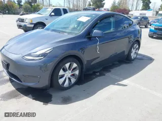 2021 Tesla Model Y Performance with VIN 5YJYGDEF7MF273897, listed as a IAAI auction lot 41925881 with 29,345 mi miles. Bid and sale history available at carsss.com. Image 2.
