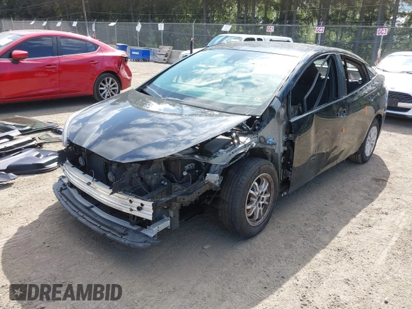 2021 Toyota Prius L Eco with VIN JTDKAMFU3M3140233, listed as a IAAI auction lot 42182685 with 38,842 mi miles and . Bid and sale history available at DreamBid. Image 2.