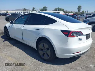 2023 Tesla Model 3 with VIN 5YJ3E1EA0PF621448, listed as a IAAI auction lot 42500155 with 26,589 mi miles and . Bid and sale history available at DreamBid. Image 3.