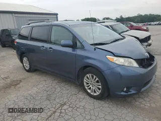 2014 Toyota Sienna XLE with VIN 5TDYK3DC2ES520840, listed as a Copart auction lot 59672295 with 194,143 mi miles and Salvage title. Bid and sale history available at DreamBid. Image 4.