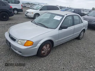 2000 Mazda Protege DX z VIN JM1BJ2225Y0211691, wystawiony jako IAAI lot #42464257 z przebiegiem 176 457 mil mil oraz . Historia ofert i sprzedaży dostępna na DreamBid. Obrazek 2.