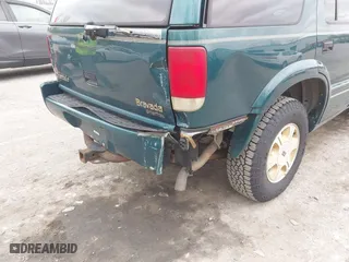 1997 Oldsmobile Bravada with VIN 1GHDT13W2V2706505, listed as a IAAI auction lot 41835475 with 131,247 mi miles. Bid and sale history available at carsss.com. Image 6.