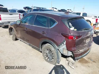2019 Mazda CX-5 Sport with VIN JM3KFABM2K0686372, listed as a IAAI auction lot 41770183 with 57,202 mi miles and . Bid and sale history available at DreamBid. Image 3.