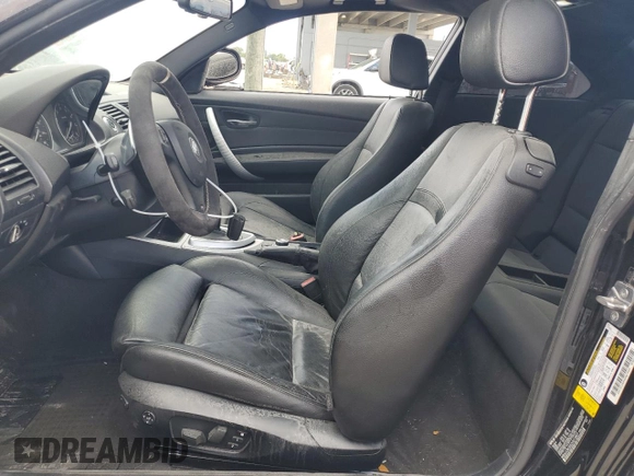 2012 BMW 1 Series 135i with VIN WBAUC9C5XCVM12807, listed as a Copart auction lot 61680225 with 117,314 mi miles and Salvage title. Bid and sale history available at DreamBid. Image 7.
