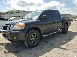 2015 Nissan Titan Pro-4X with VIN 1N6BA0EC1FN507491, listed as a Copart auction lot 51240915 with 165,510 mi miles and Salvage title. Bid and sale history available at DreamBid. Image 1.