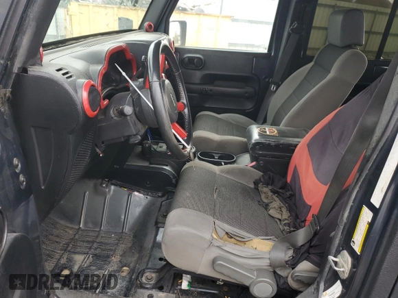 2007 Jeep Wrangler Unlimited X with VIN 1J4GA391X7L171902, listed as a Copart auction lot 82150334 with 167,695 mi miles and Salvage title. Bid and sale history available at DreamBid. Image 7.
