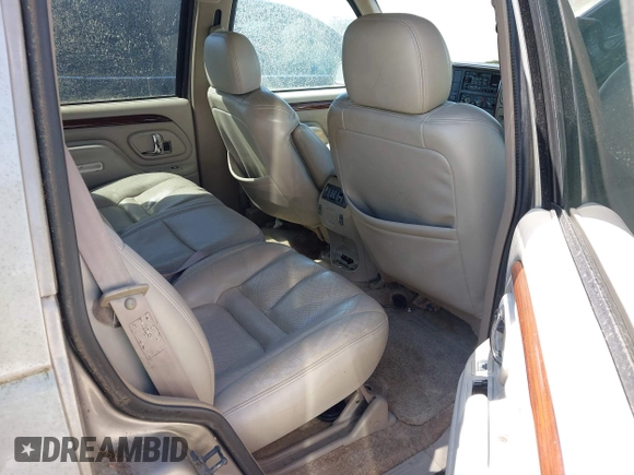 2000 Cadillac Escalade z VIN 1GYEK63R2YR209125, wystawiony jako IAAI lot #41854270 z przebiegiem 198 017 mil mil oraz . Historia ofert i sprzedaży dostępna na DreamBid. Obrazek 8.