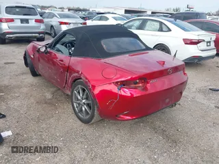 2021 Mazda MX-5 Miata Grand Touring with VIN JM1NDAD79M0454079, listed as a IAAI auction lot 41230199 with 104,783 mi miles and . Bid and sale history available at DreamBid. Image 3.