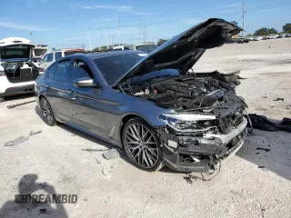 2018 BMW 5 Series M550i xDrive with VIN WBAJB9C53JB034947, listed as a Copart auction lot 77270534 with Not provided miles and Non repairable. Bid and sale history available at DreamBid. Image 4.