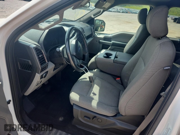 2019 Ford F-150 XL with VIN 1FTFW1E4XKFA16846, listed as a Copart auction lot 61345795 with 128,587 mi miles and Salvage title. Bid and sale history available at DreamBid. Image 7.