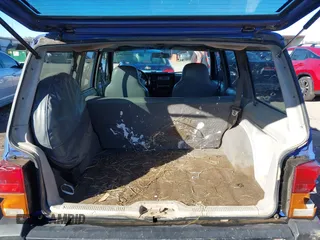 1996 Jeep Cherokee Sport with VIN 1J4FJ68S6TL171428, listed as a IAAI auction lot 40881632 with 323,289 mi miles. Bid and sale history available at carsss.com. Image 8.