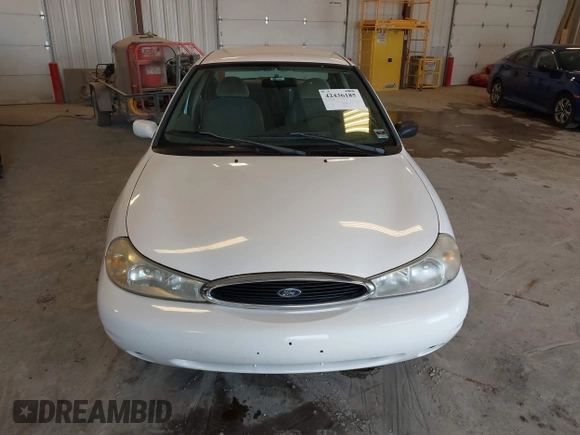 1999 Ford Contour SE z VIN 1FAFP6634XK138025, wystawiony jako IAAI lot #42436185 z przebiegiem 90 226 mil mil oraz . Historia ofert i sprzedaży dostępna na DreamBid. Obrazek 6.