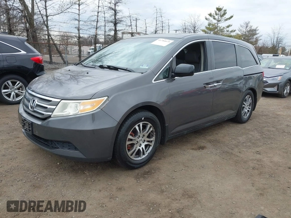 2012 Honda Odyssey EX-L with VIN 5FNRL5H65CB042898, listed as a IAAI auction lot 41784075 with 179,596 mi miles and . Bid and sale history available at carsss.com. Image 2.