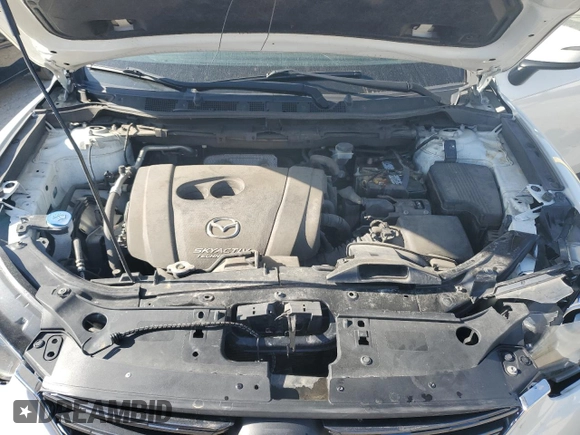 2016 Mazda CX-5 Touring z VIN JM3KE2CYXG0683673, wystawiony jako Copart lot #56724025 z przebiegiem 107 293 mil mil oraz Szkoda całkowita • Salvage title. Historia ofert i sprzedaży dostępna na DreamBid. Obrazek 12.