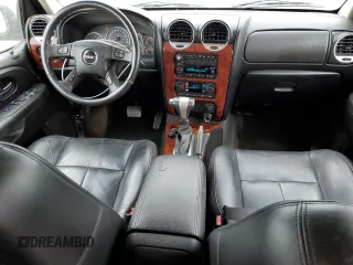2006 GMC Envoy SLE z VIN 1GKET16S566124495, wystawiony jako Copart lot #58792765 z przebiegiem 186 867 mil mil oraz Czysty tytuł • Clean title. Historia ofert i sprzedaży dostępna na DreamBid. Obrazek 8.