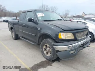 2000 Ford F-150 XL with VIN 1FTRX18L0YKA64773, listed as a IAAI auction lot 41902697 with 110,753 mi miles. Bid and sale history available at carsss.com. Image 1.