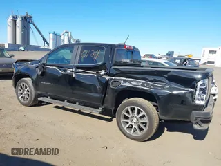 2021 GMC Canyon 4WD Denali z VIN 1GTG6EEN9M1240596, wystawiony jako IAAI lot #40760124 z przebiegiem 52 985 mil mil oraz . Historia ofert i sprzedaży dostępna na DreamBid. Obrazek 20.
