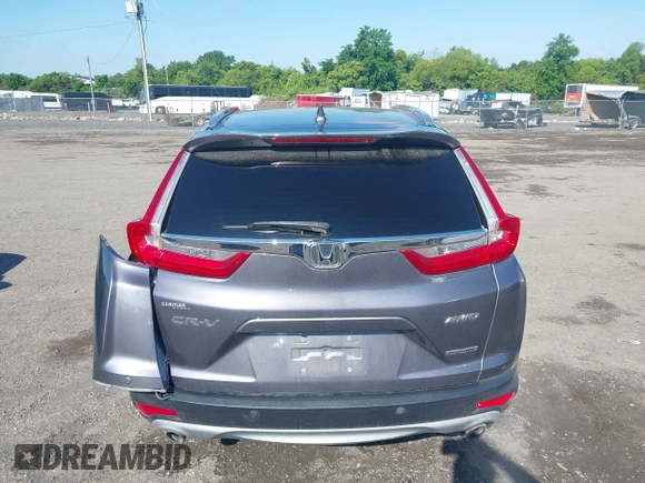 2018 Honda CR-V Touring z VIN 5J6RW2H93JL004834, wystawiony jako IAAI lot #42351364 z przebiegiem 63 746 mil mil oraz . Historia ofert i sprzedaży dostępna na DreamBid. Obrazek 16.
