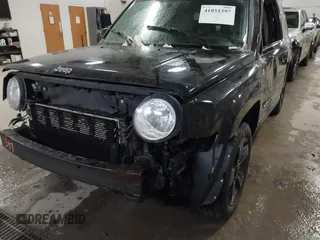 2014 Jeep Patriot Latitude with VIN 1C4NJPFB4ED645447, listed as a IAAI auction lot 41851597 with 128,319 mi miles and . Bid and sale history available at carsss.com. Image 6.